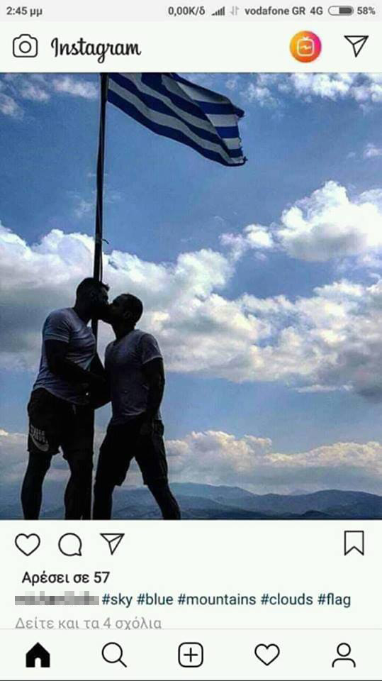 Σάλος με αξιωματικό που φιλιέται με μετανάστη μπροστά στην ελληνική σημαία