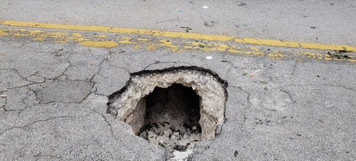 Τρύπα στη μέση του δρόμου αποδείχθηκε τούνελ για ληστεία σε τράπεζα! (BINTEO)